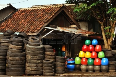4340913-colorful-trash-bin-made-from-used-tires.jpg