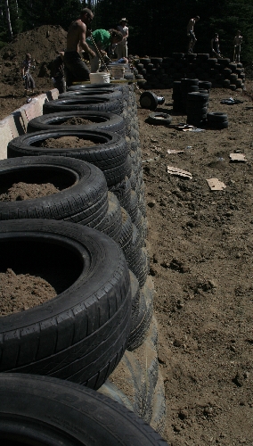 Battered-back-tire-wall-of-Michael-Reynolds-BC-Earthship-build_PC-Monica-Holy_7694.jpg