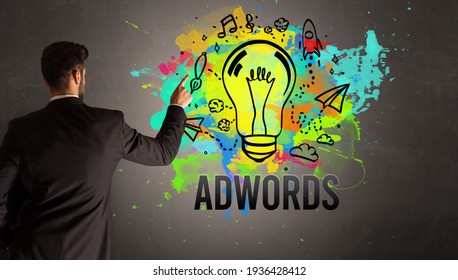 businessman-drawing-colorful-light-bulb-260nw-1936428412.jpg