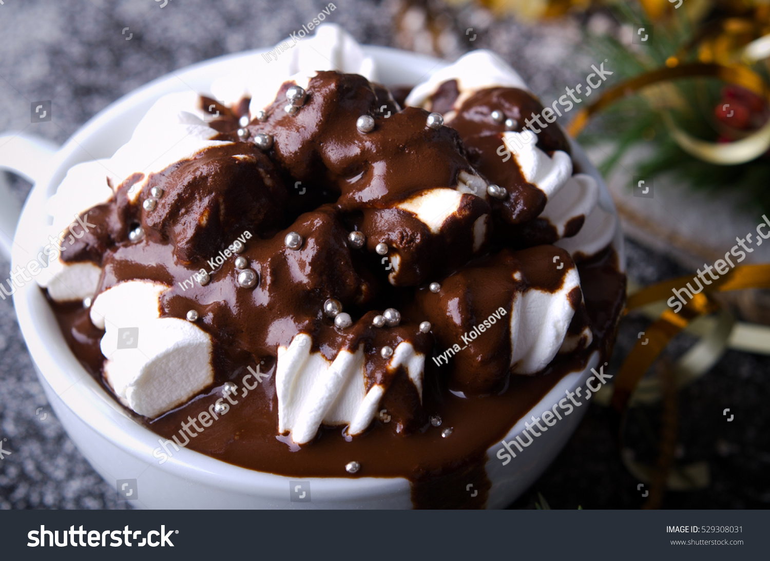 chocolate-with-marshmallows-on-snowy-wooden-table-christmas-new-year-winter-background-529308031.jpg