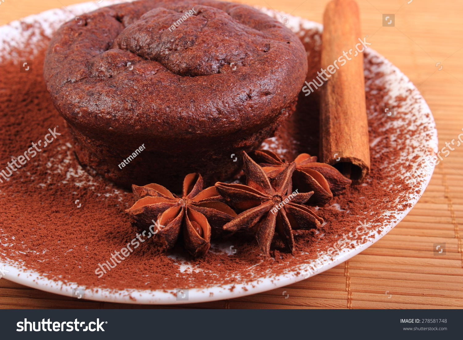 delicious-fresh-baked-chocolate-muffins-with-cocoa-star-anise-and-stick-of-cinnamon-on-278581748.jpg