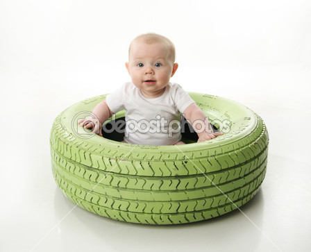 dep_4620111-Baby-sitting-inside-a-bright-painted-tire.jpg
