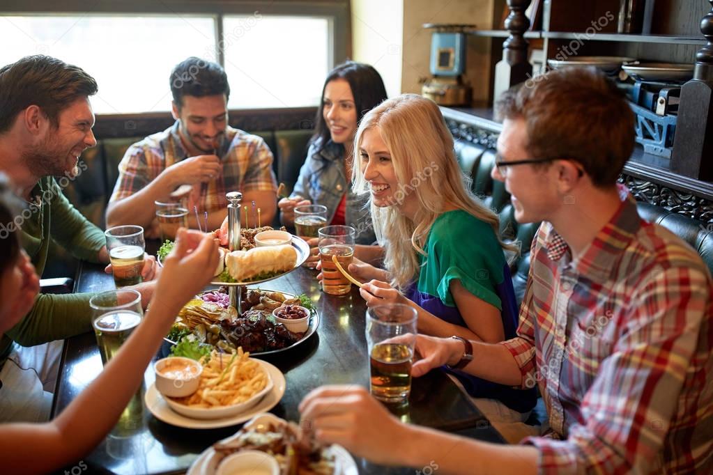 depositphotos_130478884-stock-photo-friends-dining-and-drinking-beer.jpg