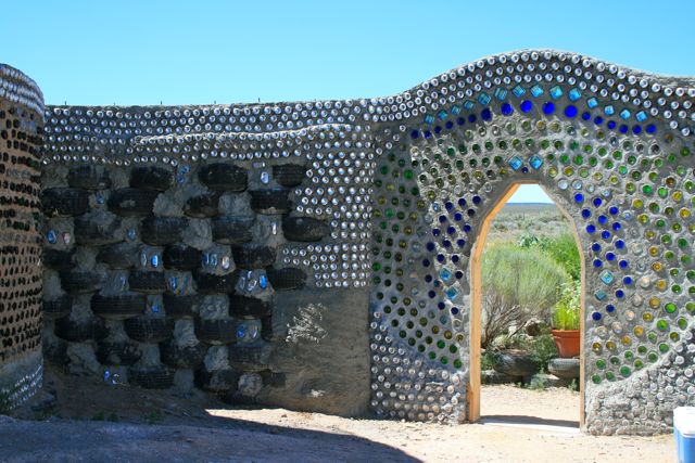 Exterior-walls-of-Earthship-recycled-tires-and-colorful-bottles.jpg