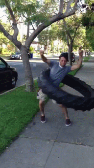 giant-tyre-hula-hoop-skills-wheel-13733892855.gif