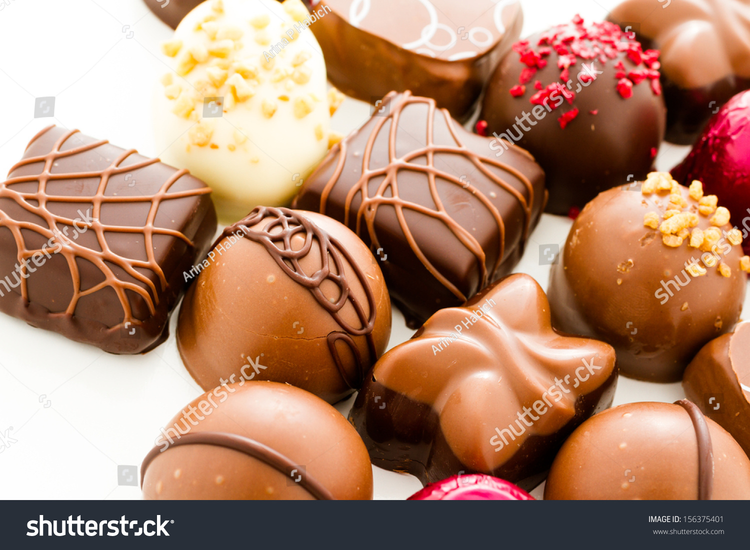 stock-photo-assortedgourmet-chocolate-candies-in-different-shapes-and-colors-156375401.jpg