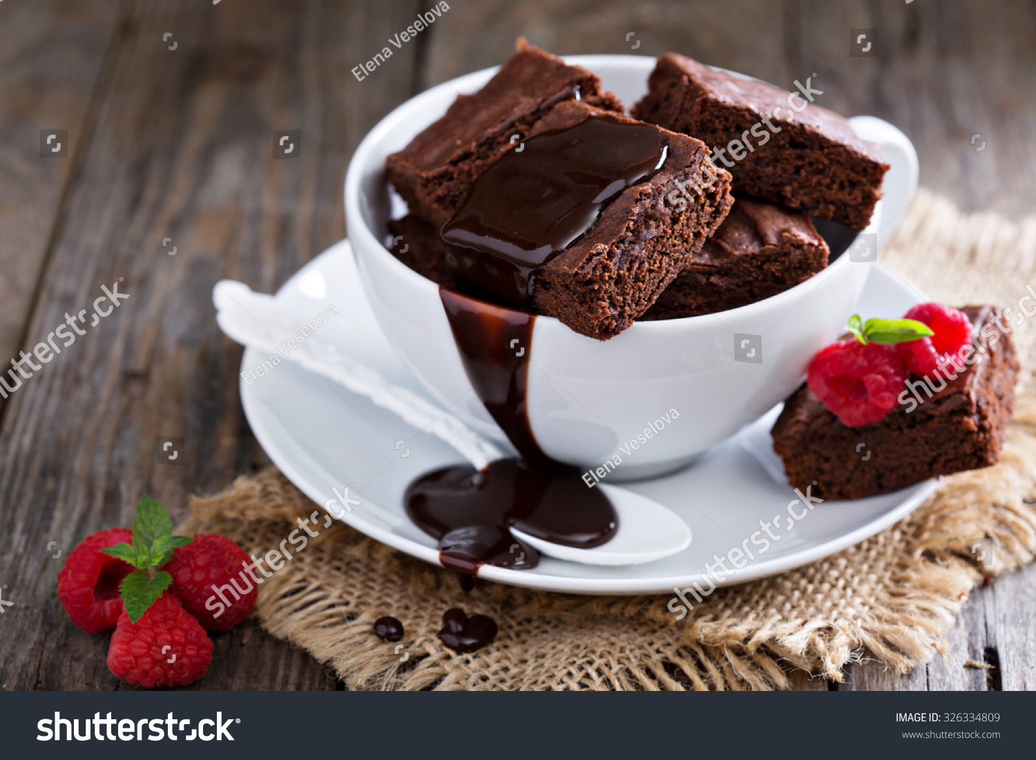 stock-photo-brownies-in-stacked-coffee-cups-with-hot-fudge-chocolate-sauce-326334809.jpg