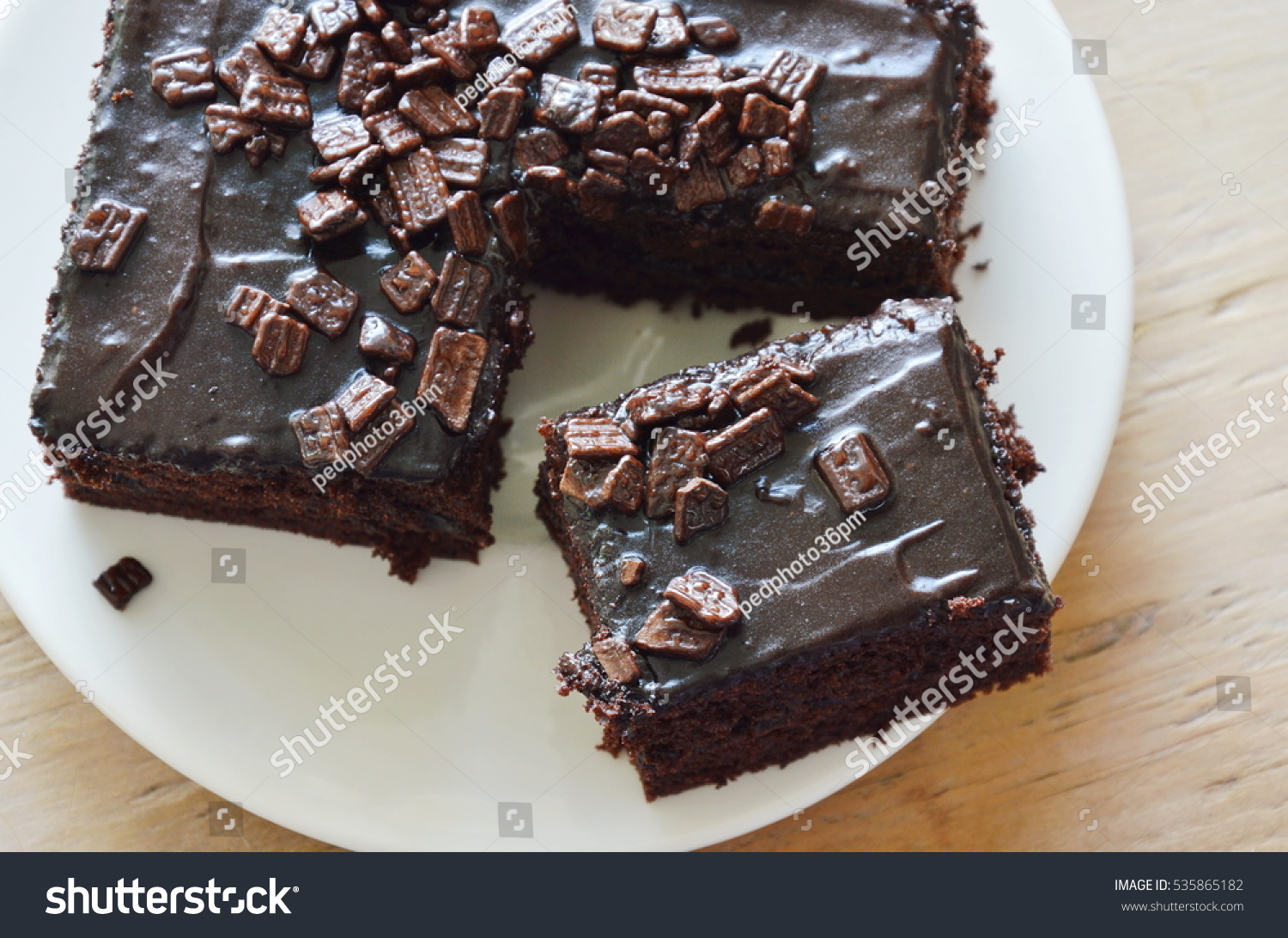 stock-photo-chocolate-butter-cake-cut-for-piece-on-dish-535865182.jpg
