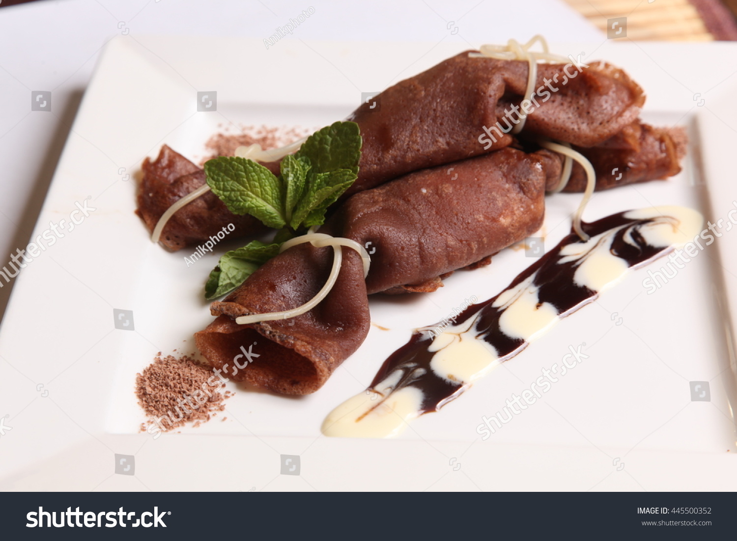 stock-photo-chocolate-pancake-with-cream-and-fruit-and-sauce-445500352.jpg