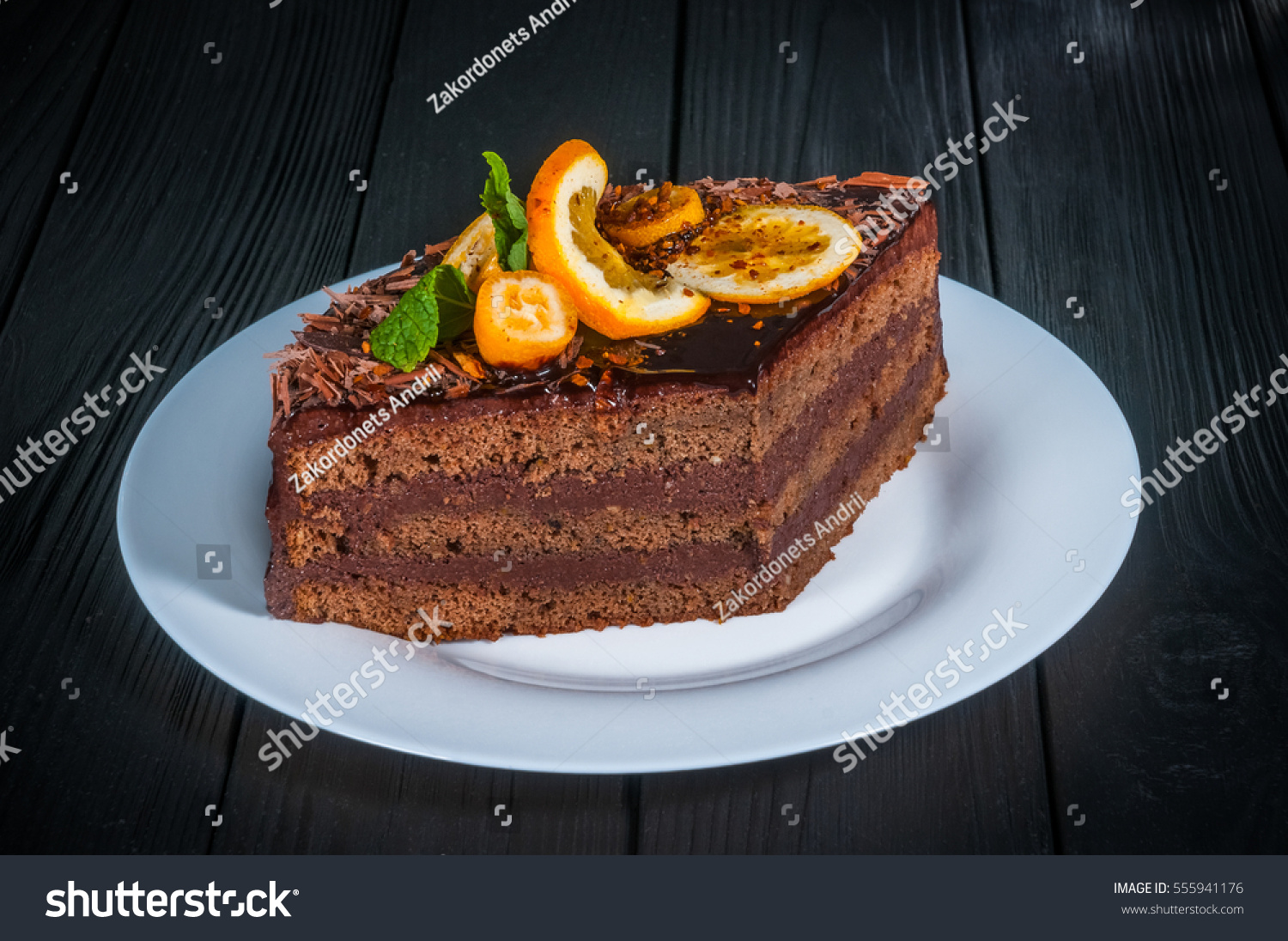 stock-photo-delicious-cake-on-a-wooden-black-background-555941176.jpg