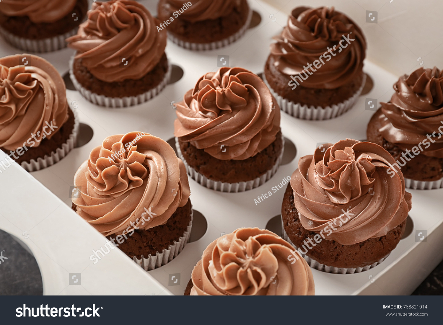 stock-photo-delicious-chocolate-cupcakes-in-cardboard-box-768821014.jpg