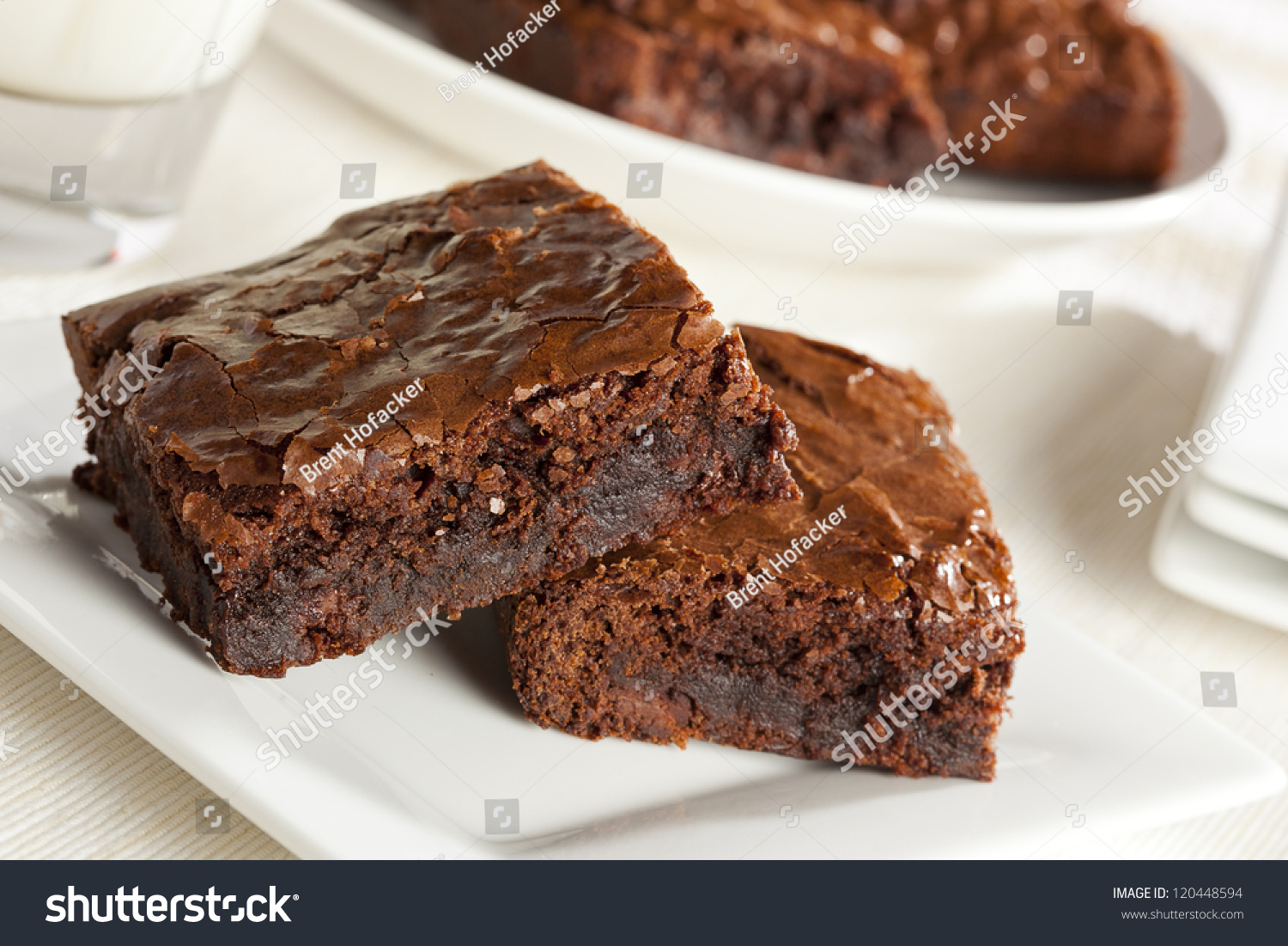 stock-photo-fresh-homemade-chocolate-brownie-against-a-background-120448594.jpg