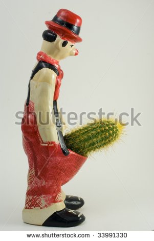 stock-photo-sad-clown-with-a-large-cactus-in-his-pants-33991330.jpg