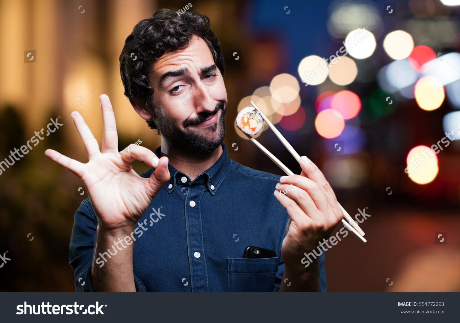 stock-photo-young-man-eating-sushi-all-right-concept-554772298.jpg